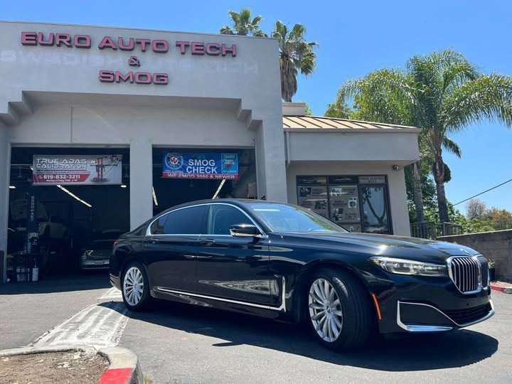 Black BMW 740i car parked outside of our shop | Euro Auto Tech & Smog