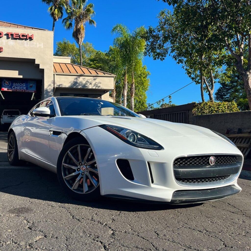 White Jaguar F-Type Parked outside of our shop | Euro Auto Tech & Smog