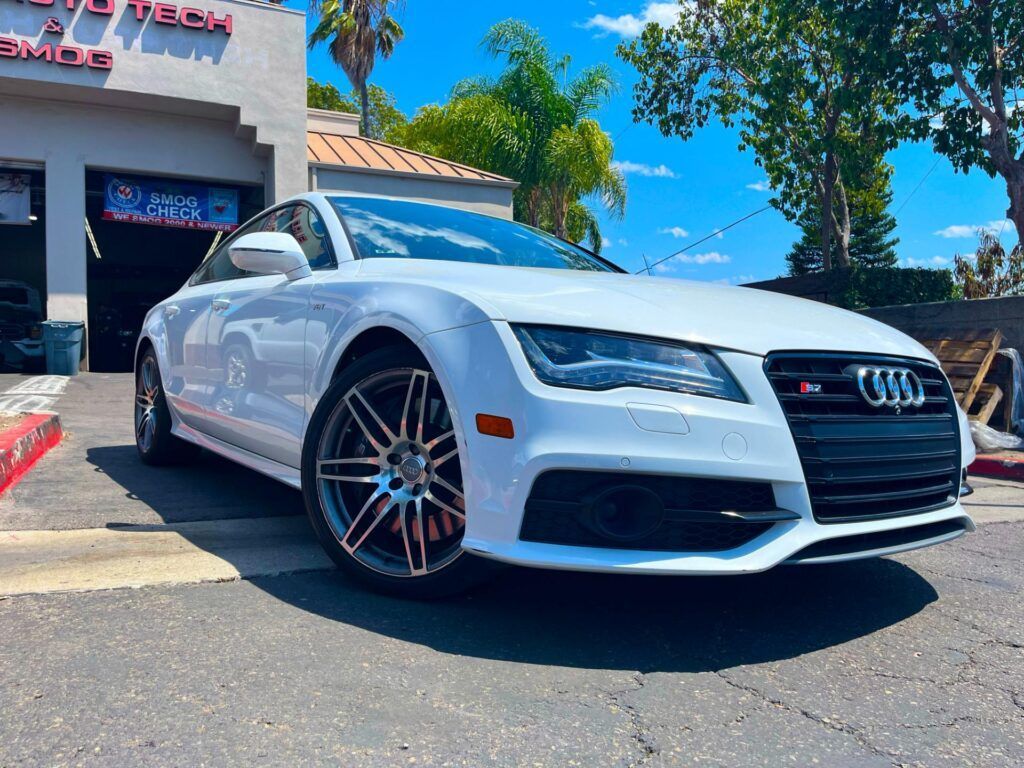 White Audi car parked outside of our shop | Euro Auto Tech & Smog