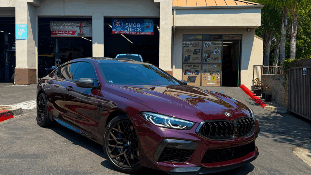 Red BMW Car parked outside of our shop | Euro Auto Tech & Smog