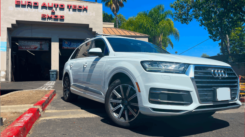 2017 Audi Q7 white car parked outside of the shop | Euro Auto Tech & Smog