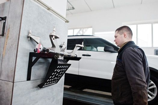 Technician observing inside garage | Euro Auto Tech & Smog