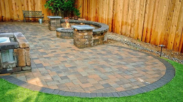 There is a fire pit in the middle of the patio.