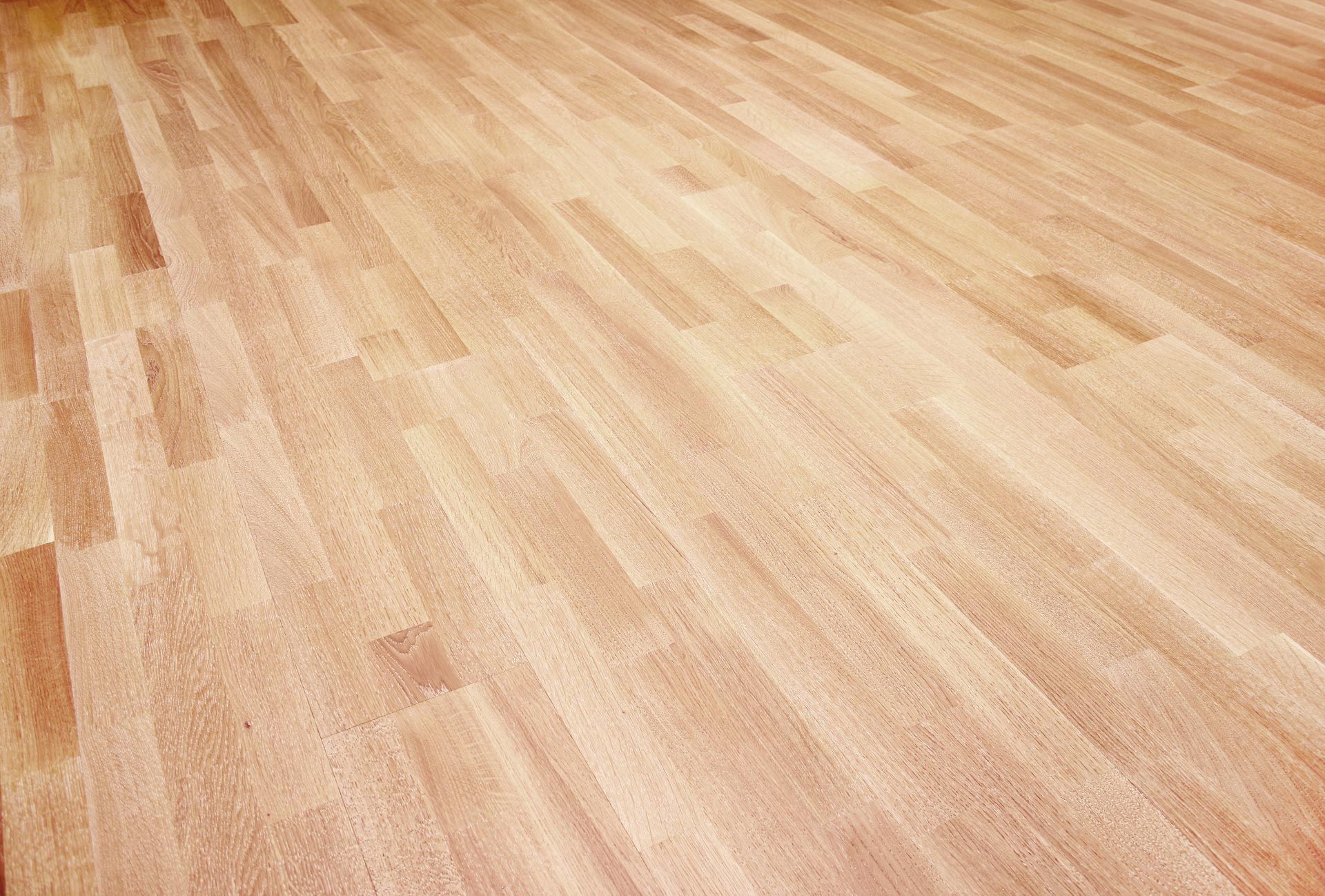 A close up of a wooden floor in a room.