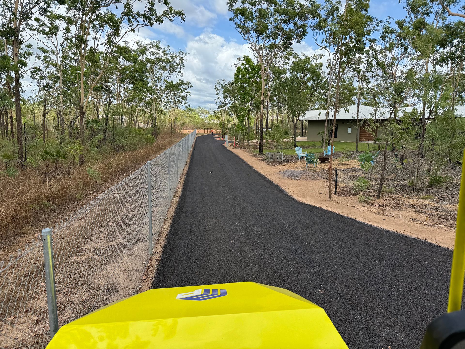 Fresh Asphalt on a trail  with yellow machine — Appian Roads In Urangan, QLD