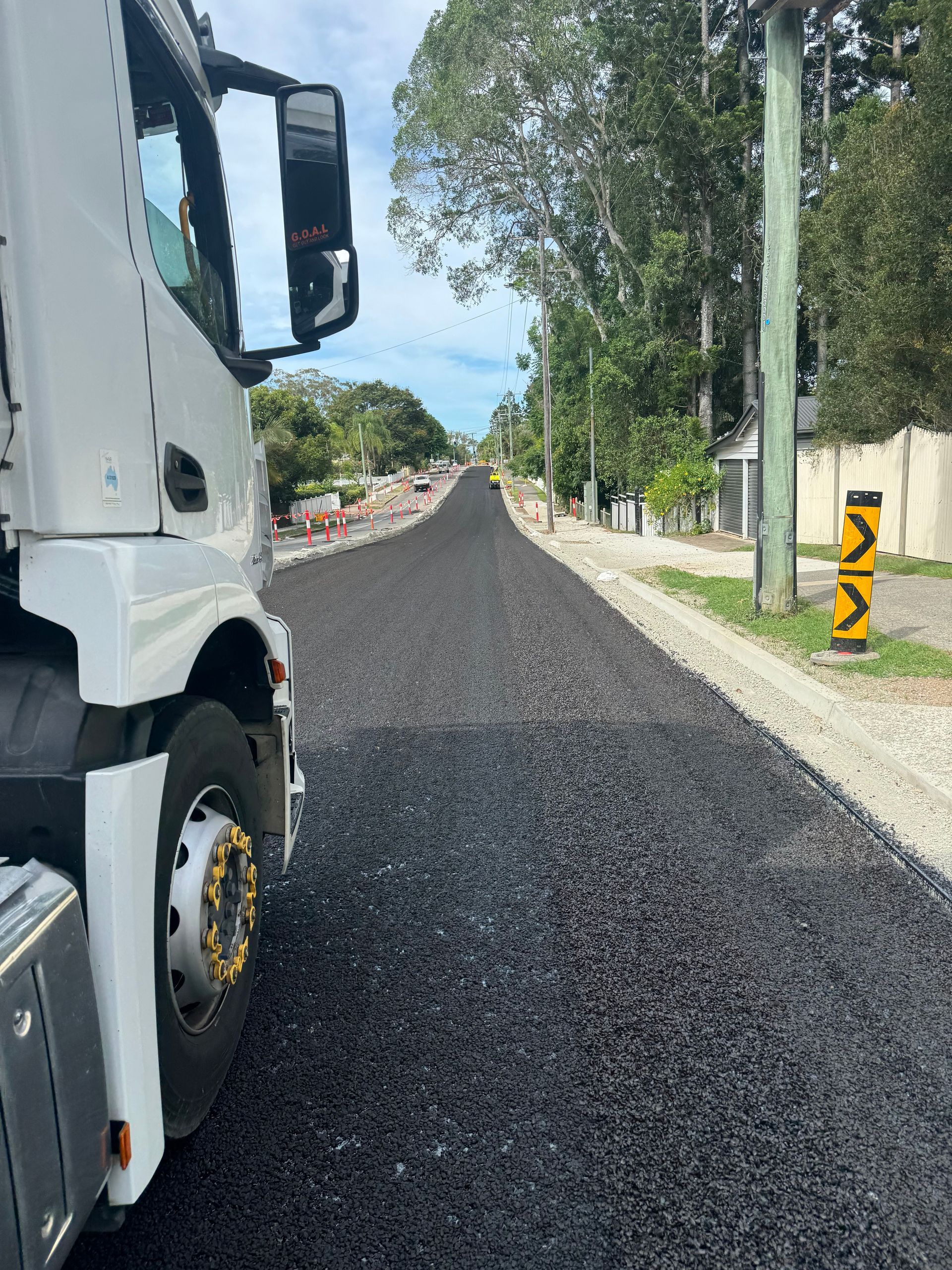 Fresh Asphalt on a road with a white truck — Appian Roads In Urangan, QLD