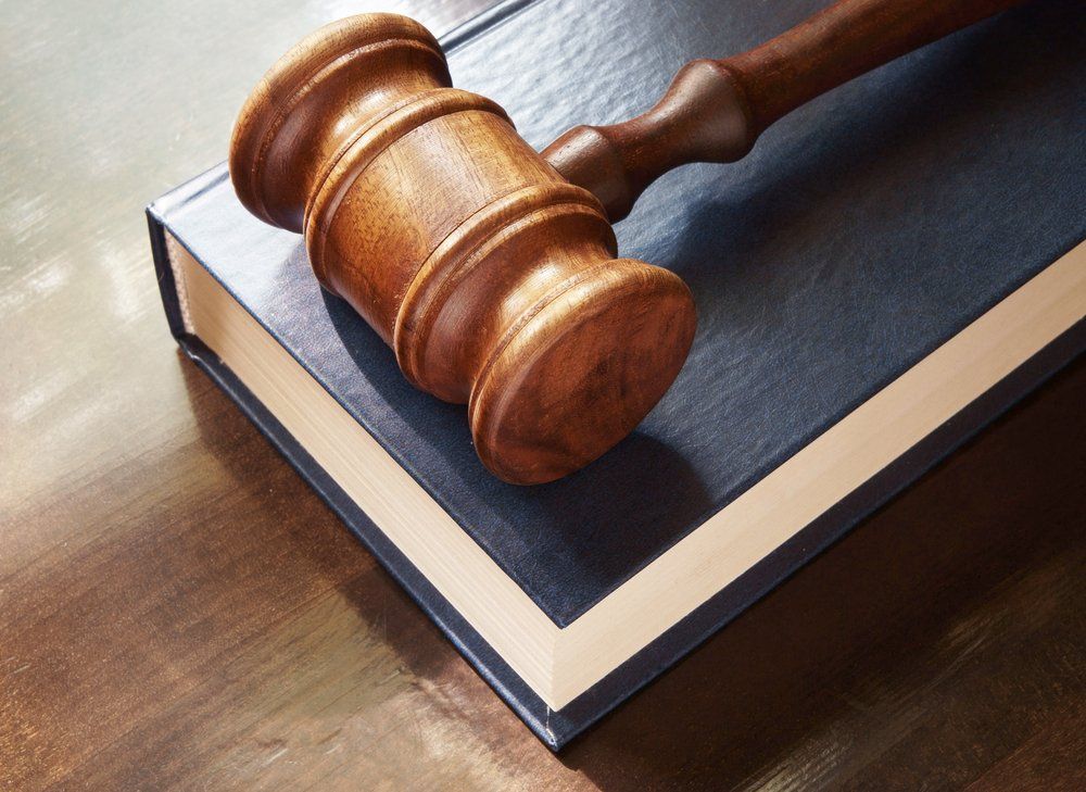 Gavel and Legal Book on Wooden Table — Cairns Traffic Lawyers  in Cairns, QLD