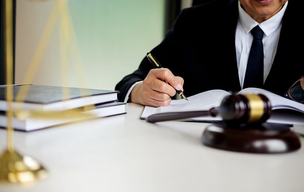Lawyer Looking Over Documents — Cairns Traffic Lawyers  in Cairns, QLD