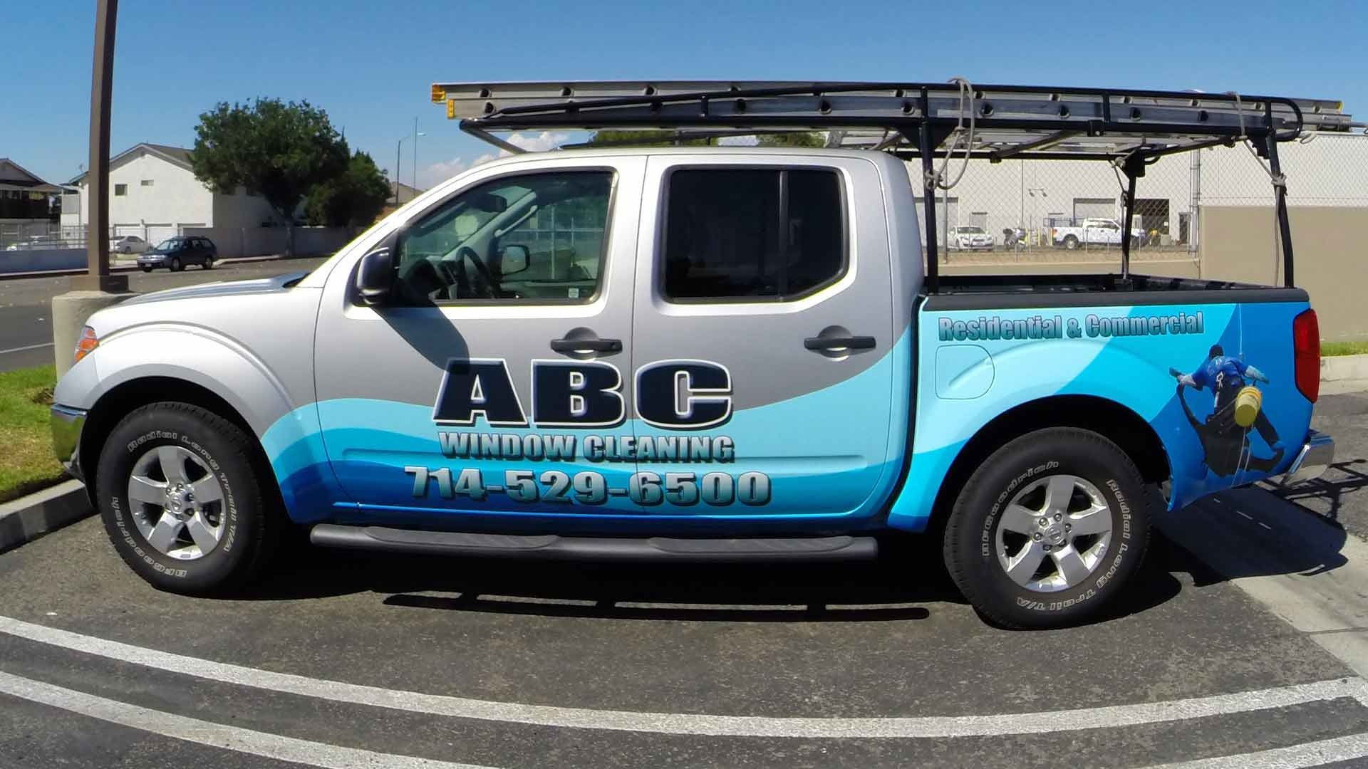 A silver pickup truck branded with 
