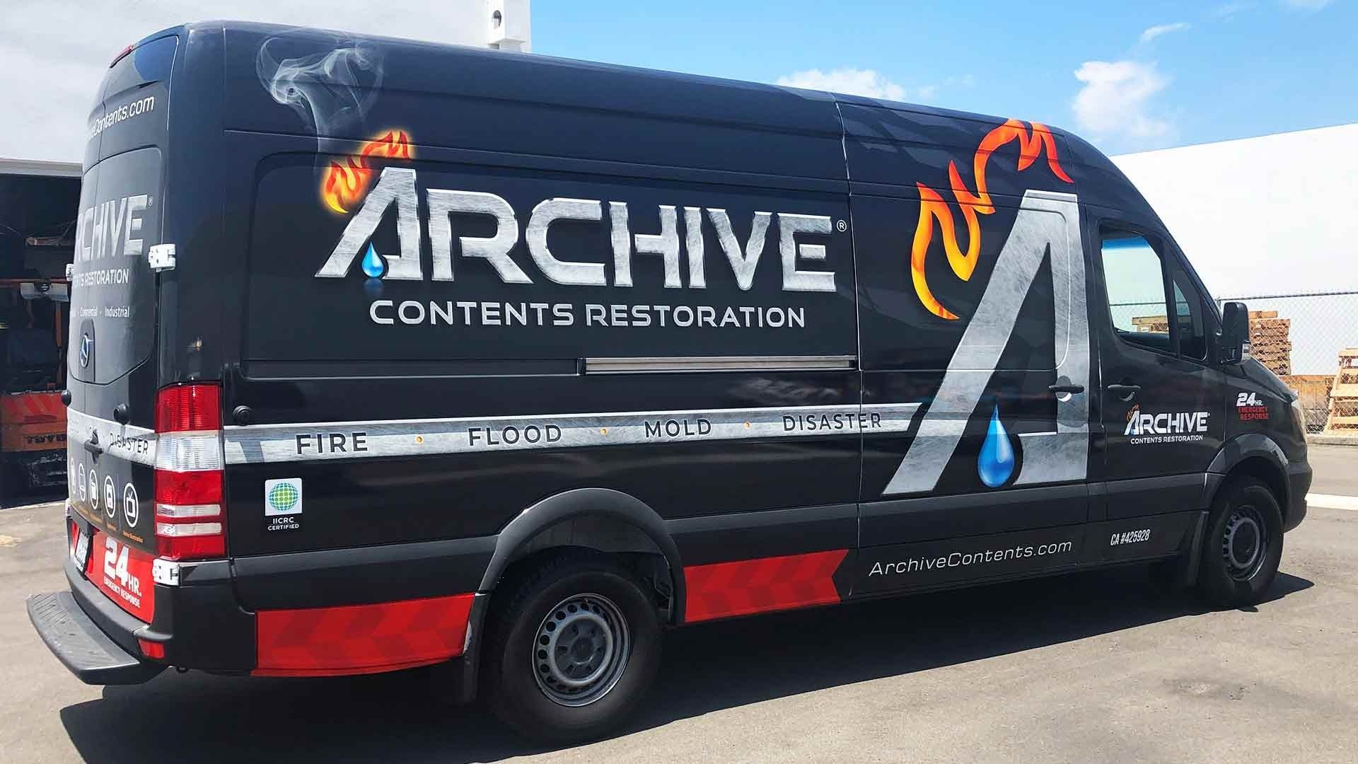 A black service van with 