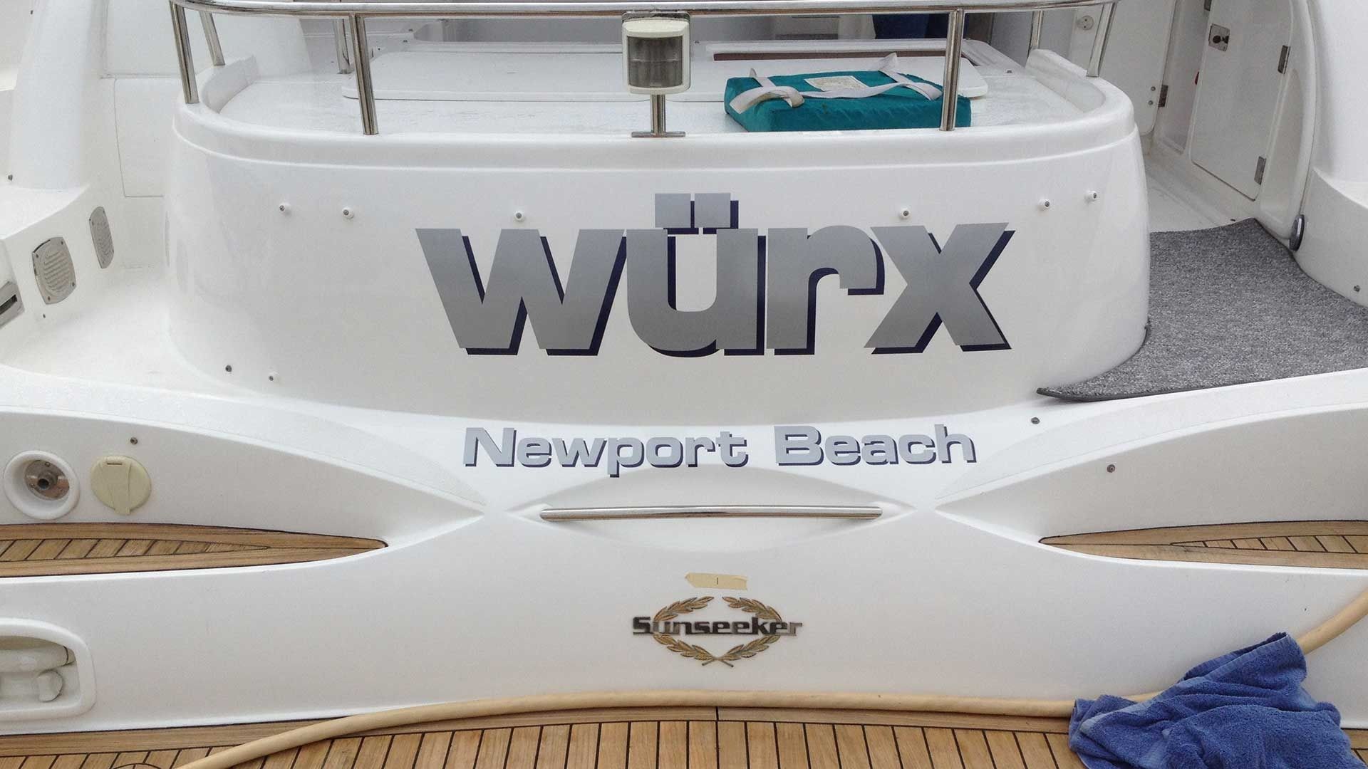 Stern view of a white boat named 