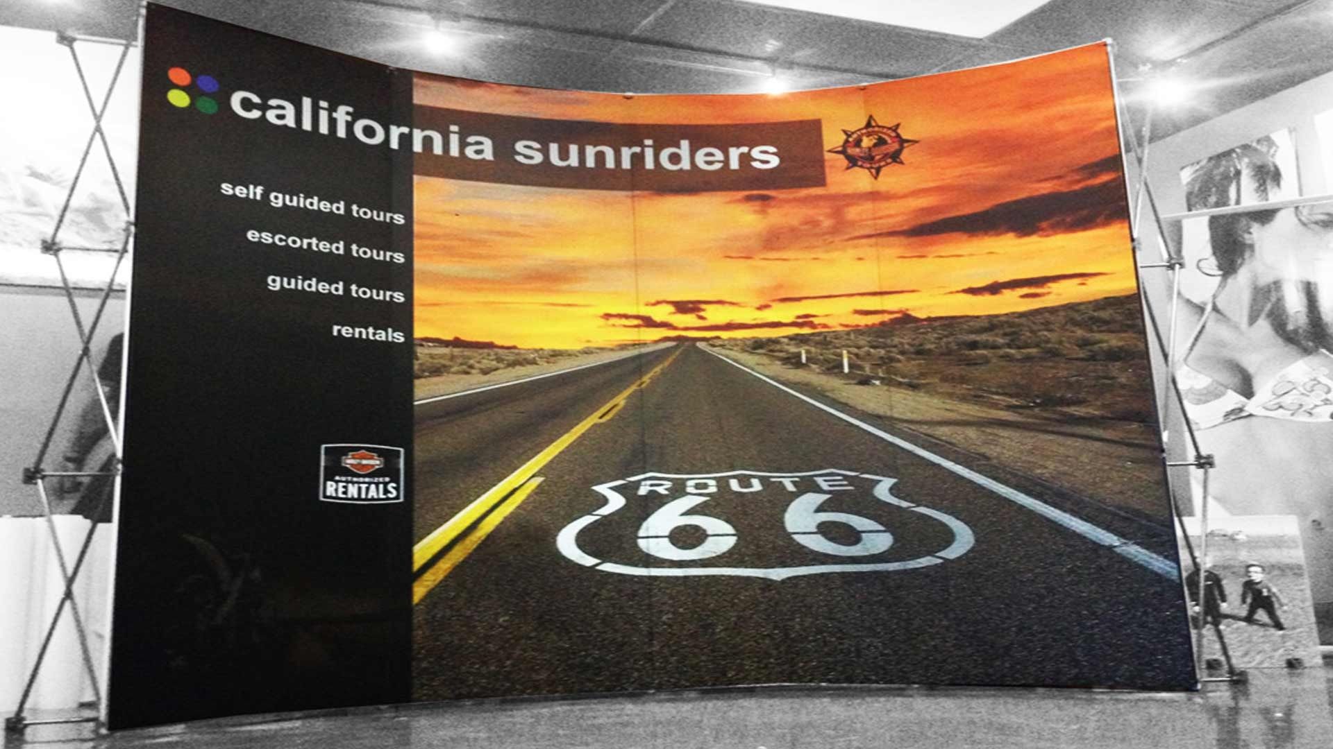 A curved trade show display featuring 
