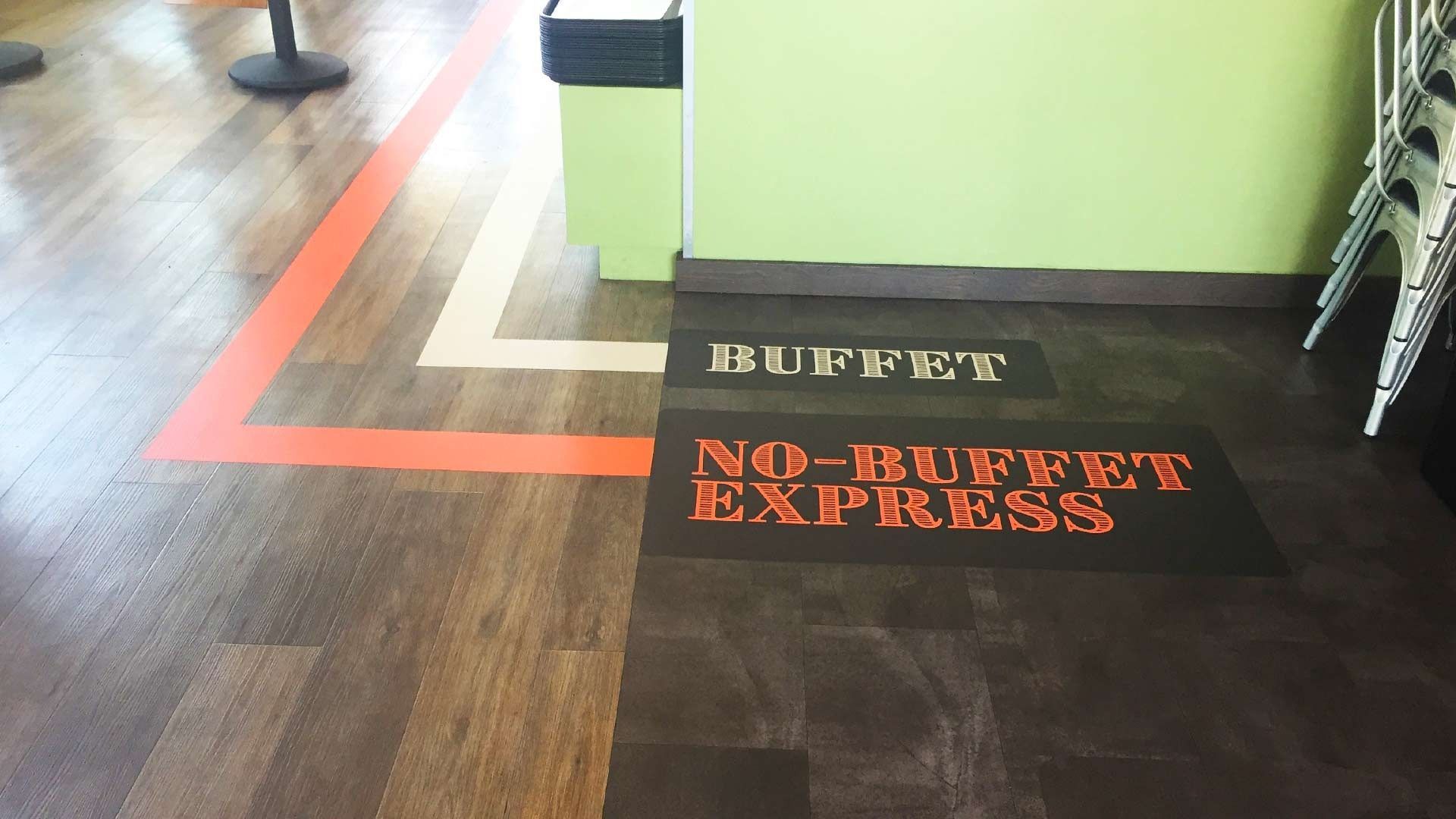 Floor markings in a restaurant direct traffic to either the 