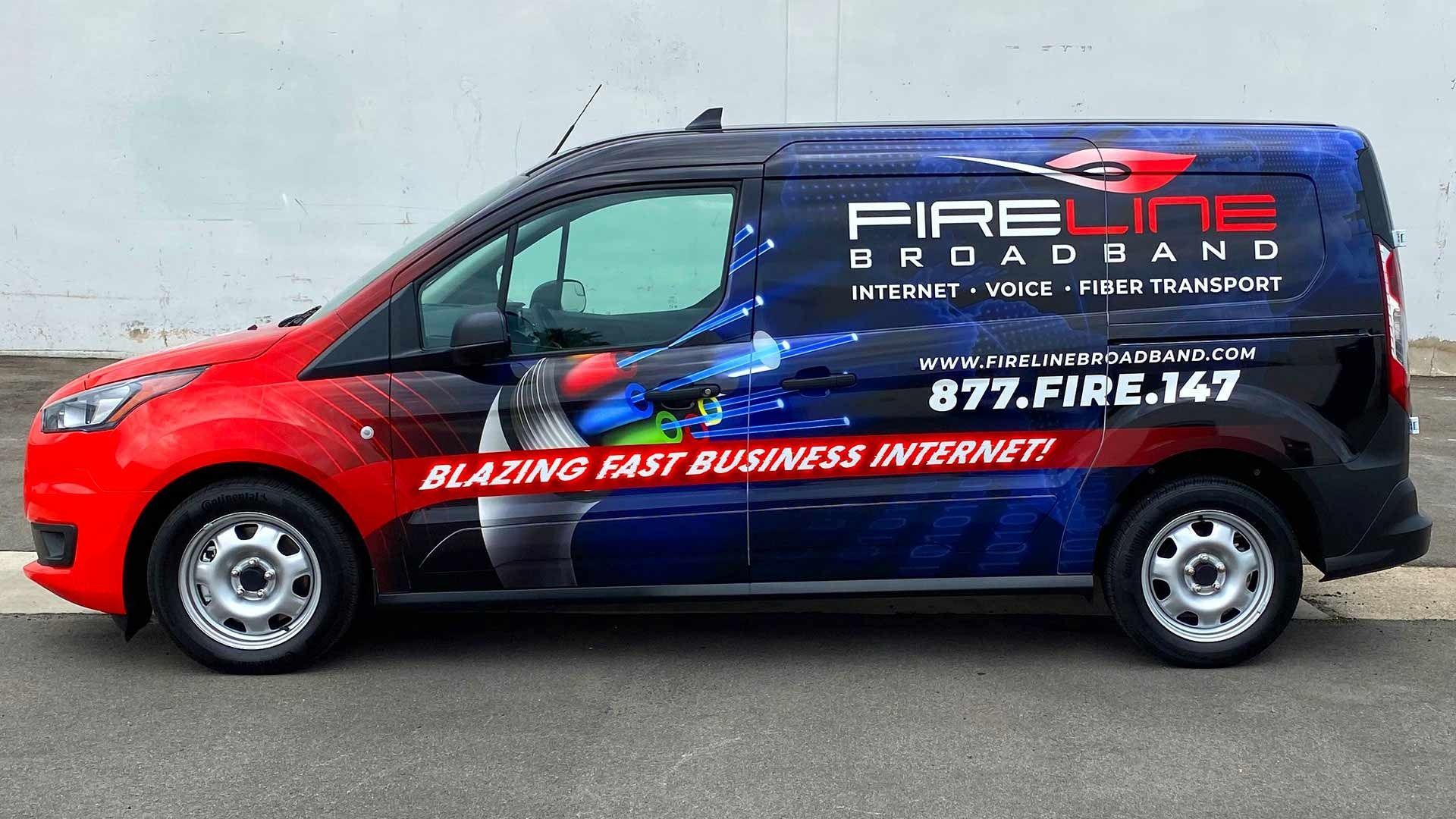 A red and blue branded Fireline Broadband service van parked on asphalt.