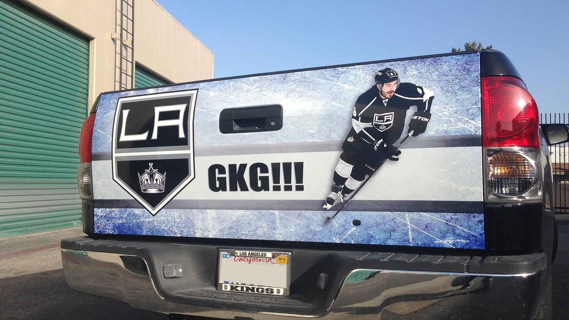 A truck tailgate wrapped in Los Angeles Kings hockey branding with the team logo, 
