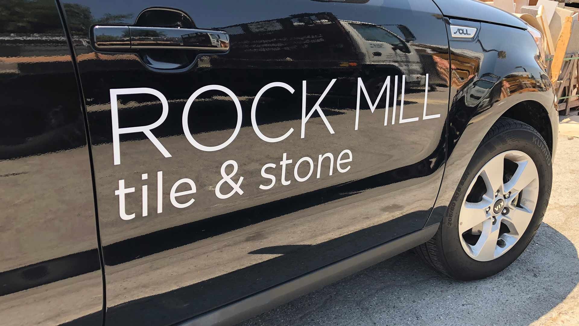 A black car door featuring the white text 