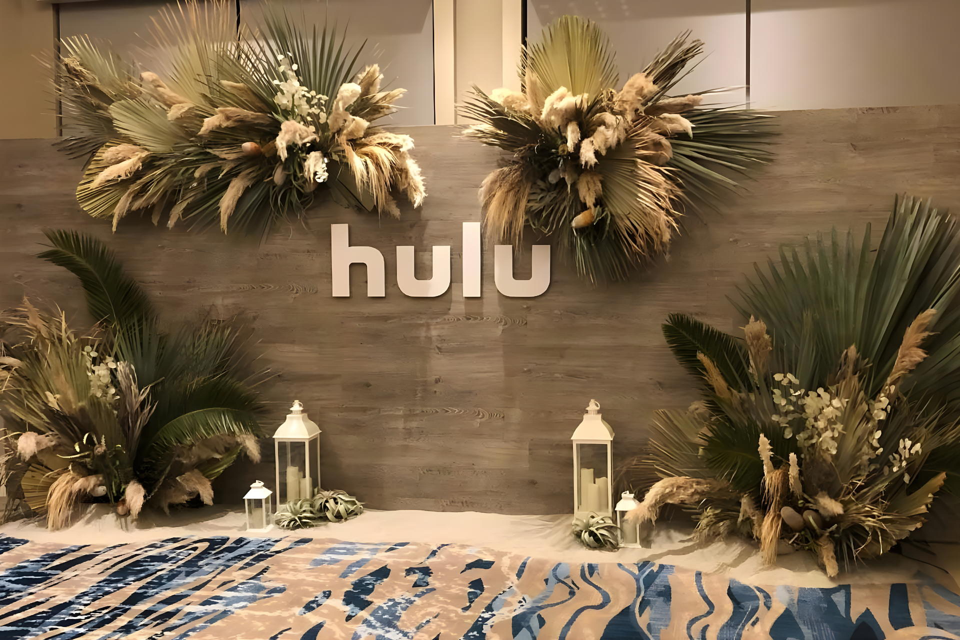 Large, dusty pink 3D letters spelling 