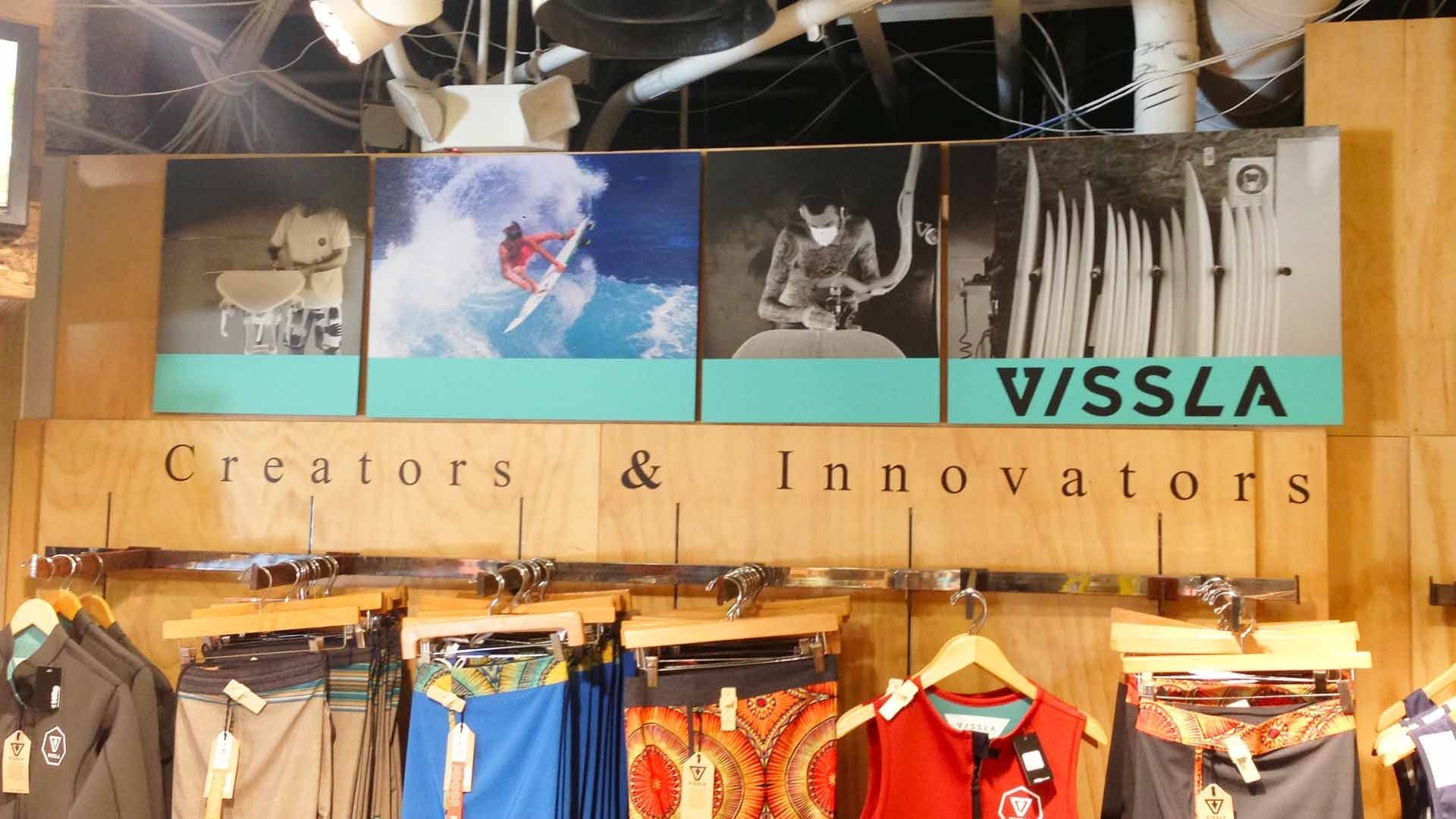 Vissla store display featuring four surf-themed photos and 