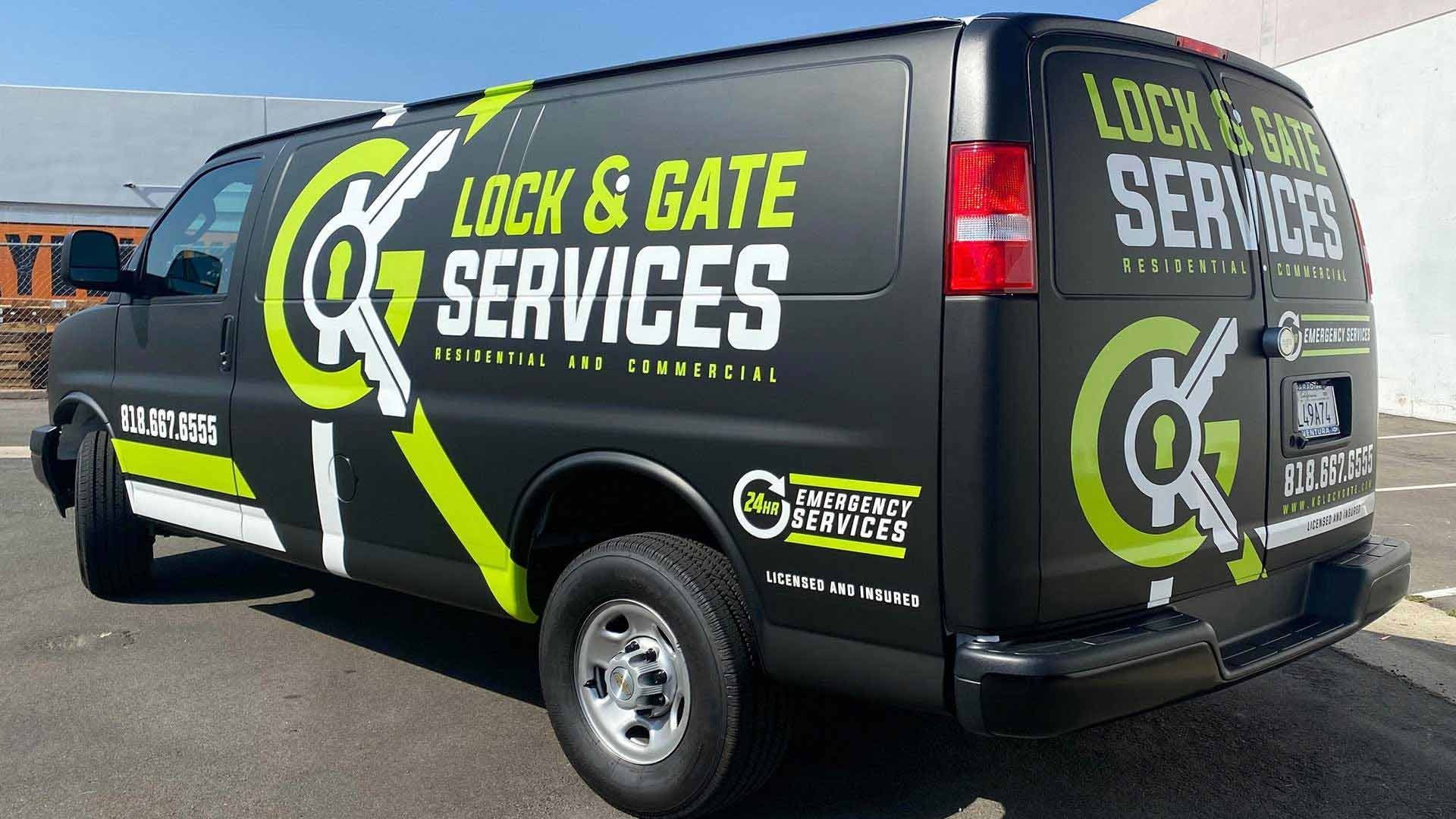 A matte black work van with bright green logos and 
