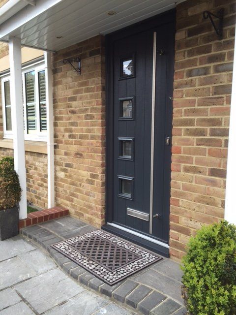 black door with 4 square glass