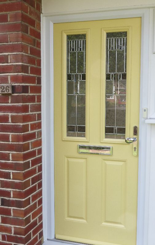 yellow front door with two glass panels