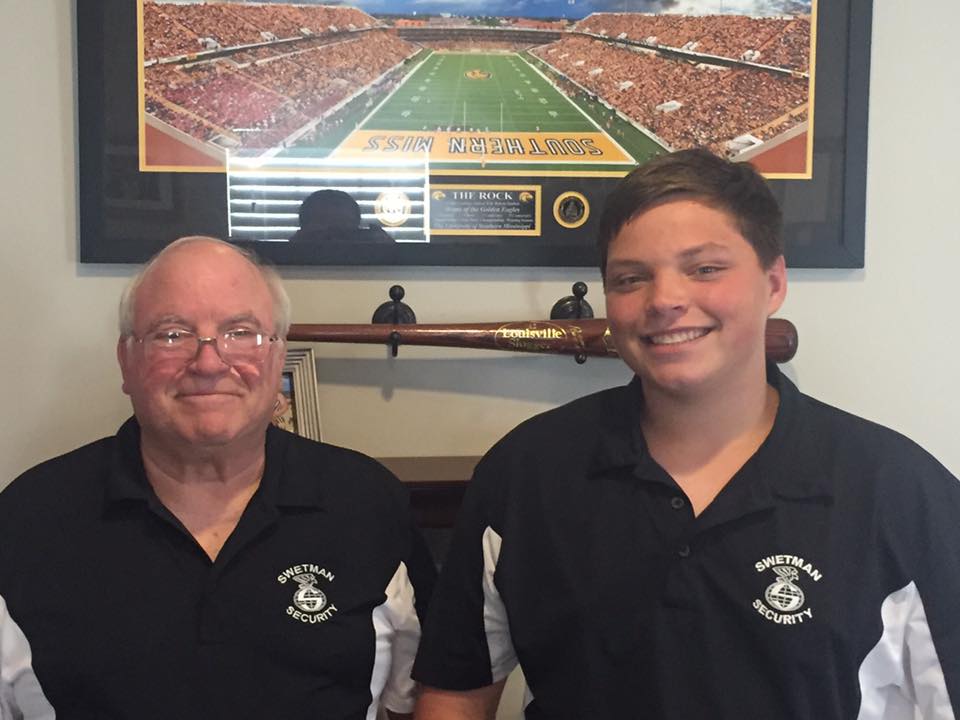 Senior Man and Young Man Smiling — Biloxi, MS — Swetman Security Service Incorporated — Biloxi, MS — Swetman Security Service Incorporated