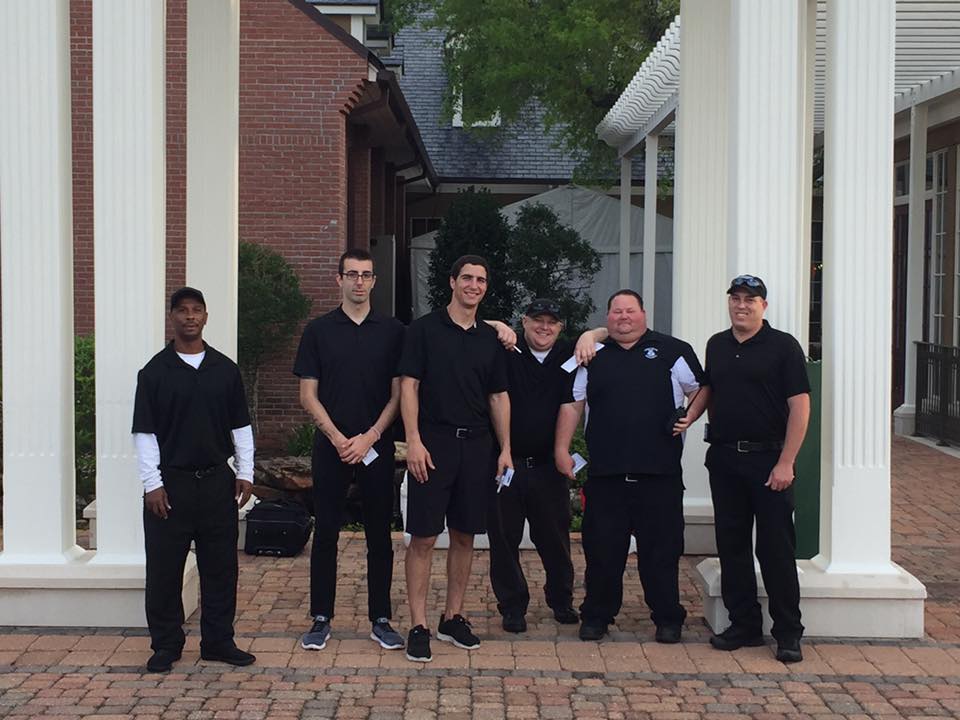 Security Service Banner Staffs Wearing Black Uniform — Biloxi, MS — Swetman Security Service Incorporated — Biloxi, MS — Swetman Security Service Incorporated
