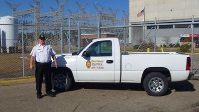Man Beside a Security Patrol Truck — Biloxi, MS — Swetman Security Service Incorporated