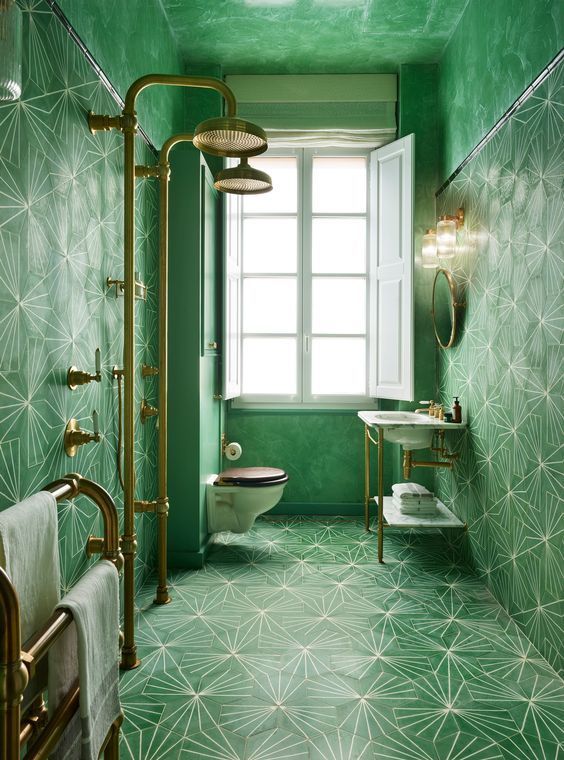 Lovely lush green bathroom with geometric bold tiles