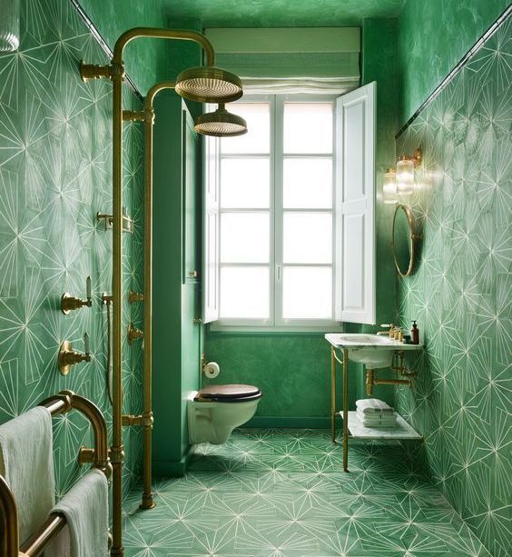 A geometric tiled bathroom in deep green