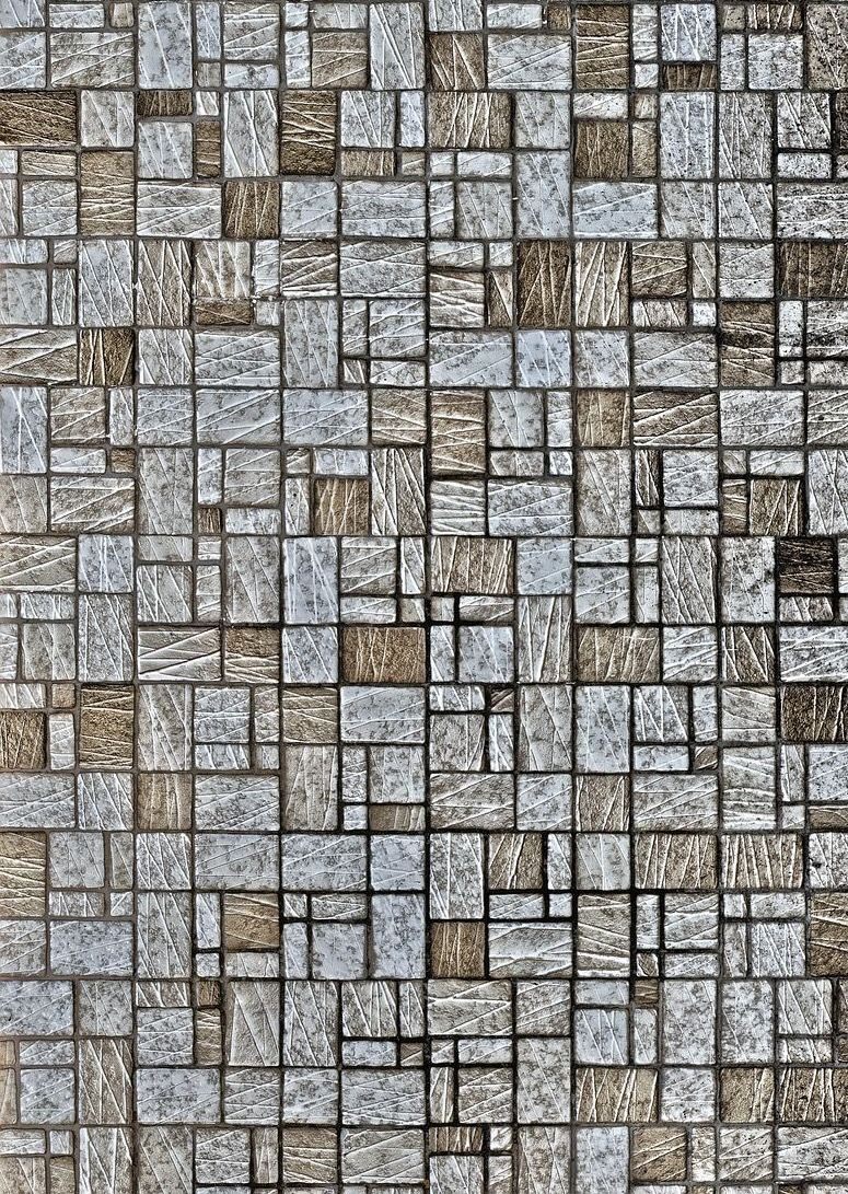 A close up of a mosaic tile wall.