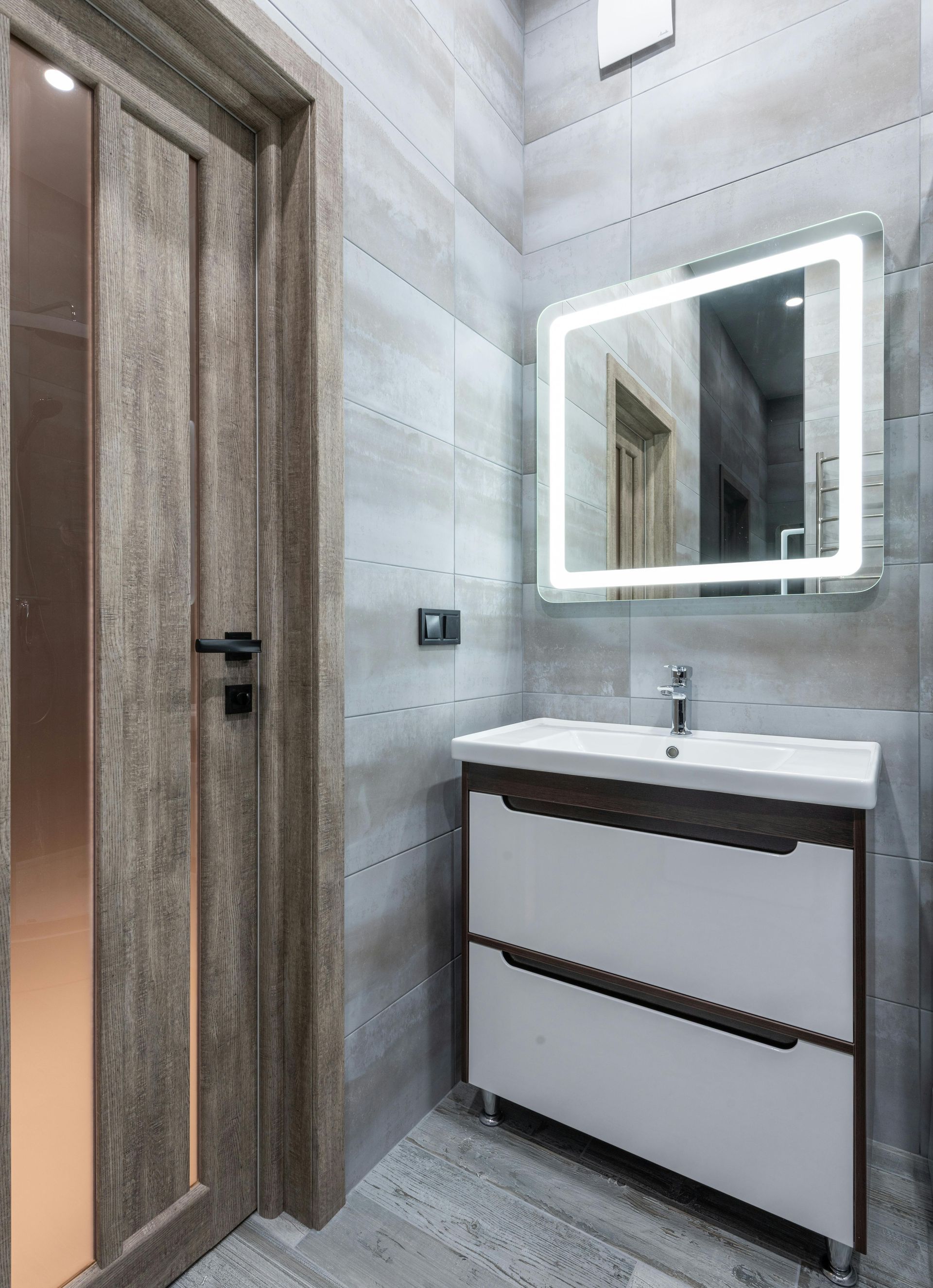 A lovely modern tiled marble luxury bathroom