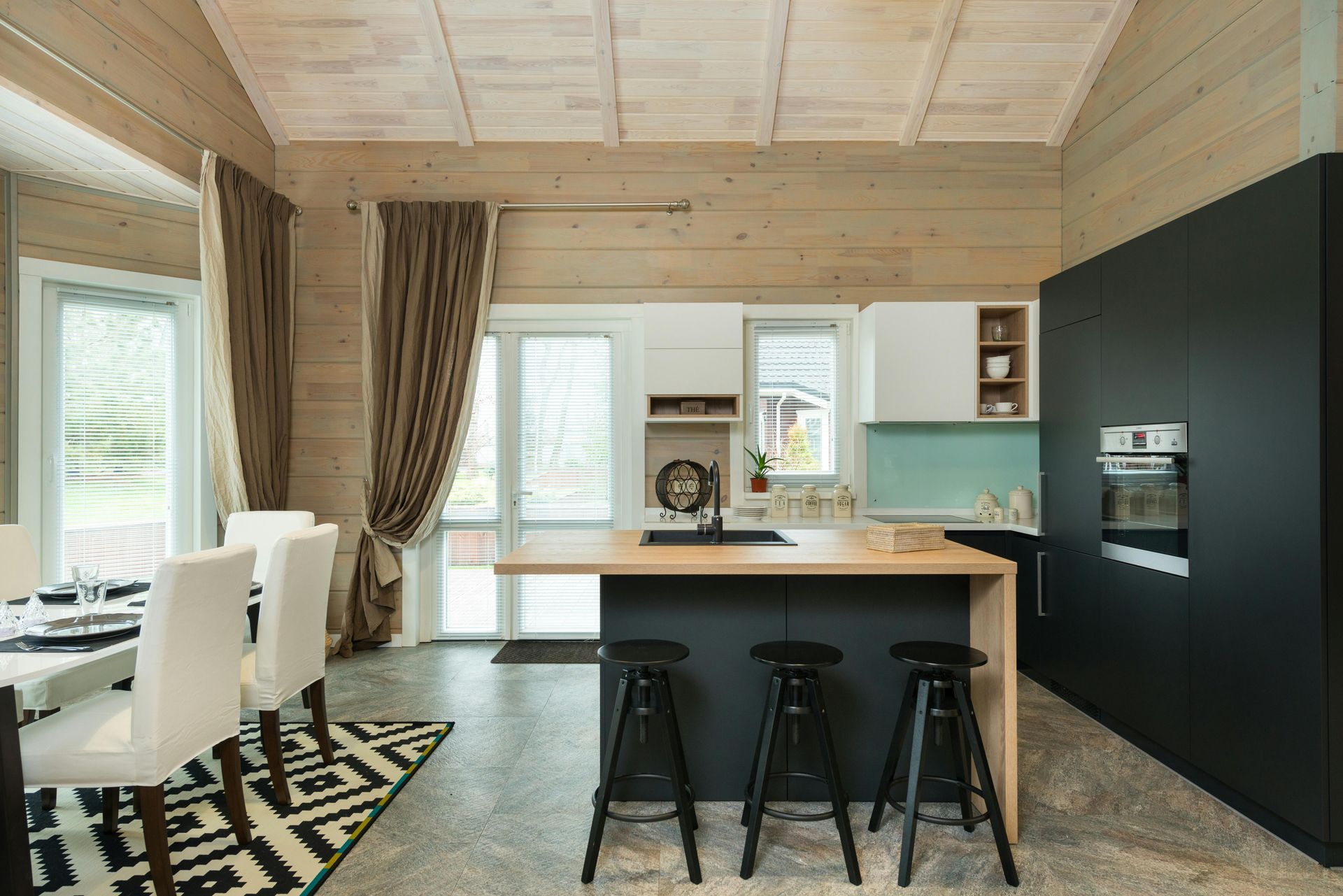 Lovely tiled flooring in a modern monochrome kitchen in Stoke-On-Trent by Rose tiing.
