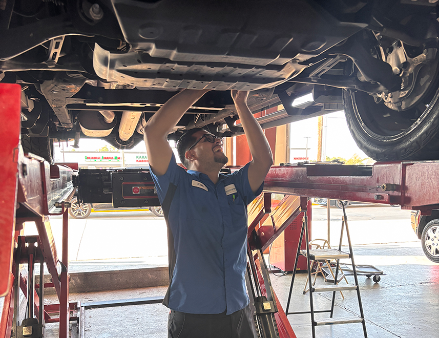 A mechanic performing a wheel alignment service - Elite Auto Experts 