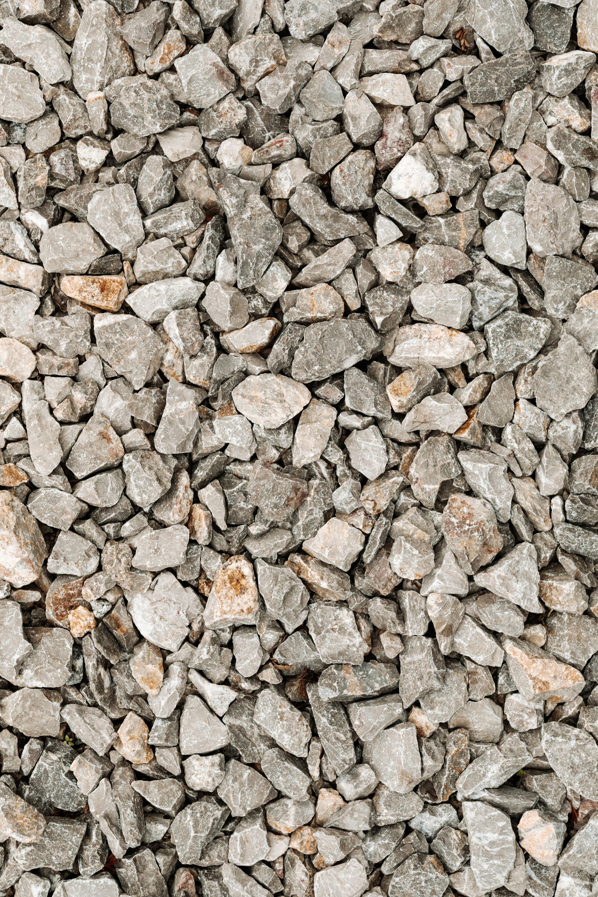 A pile of gravel is sitting on the ground.
