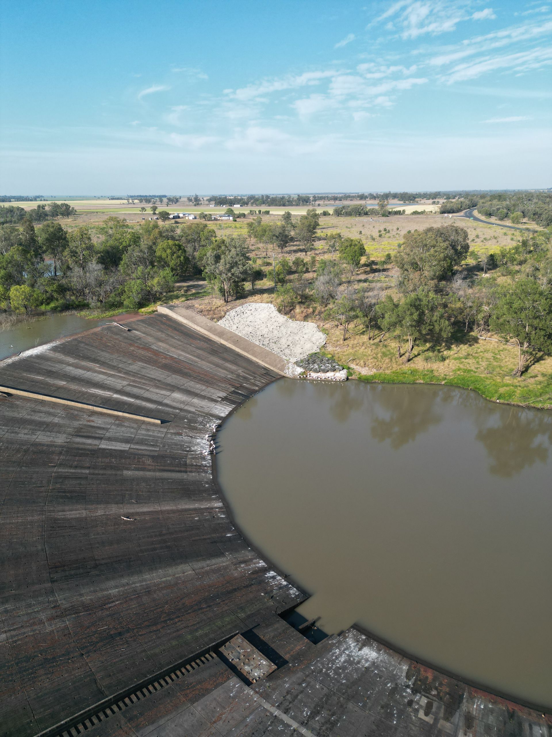 An aerial view of a large body of water surrounded by trees.