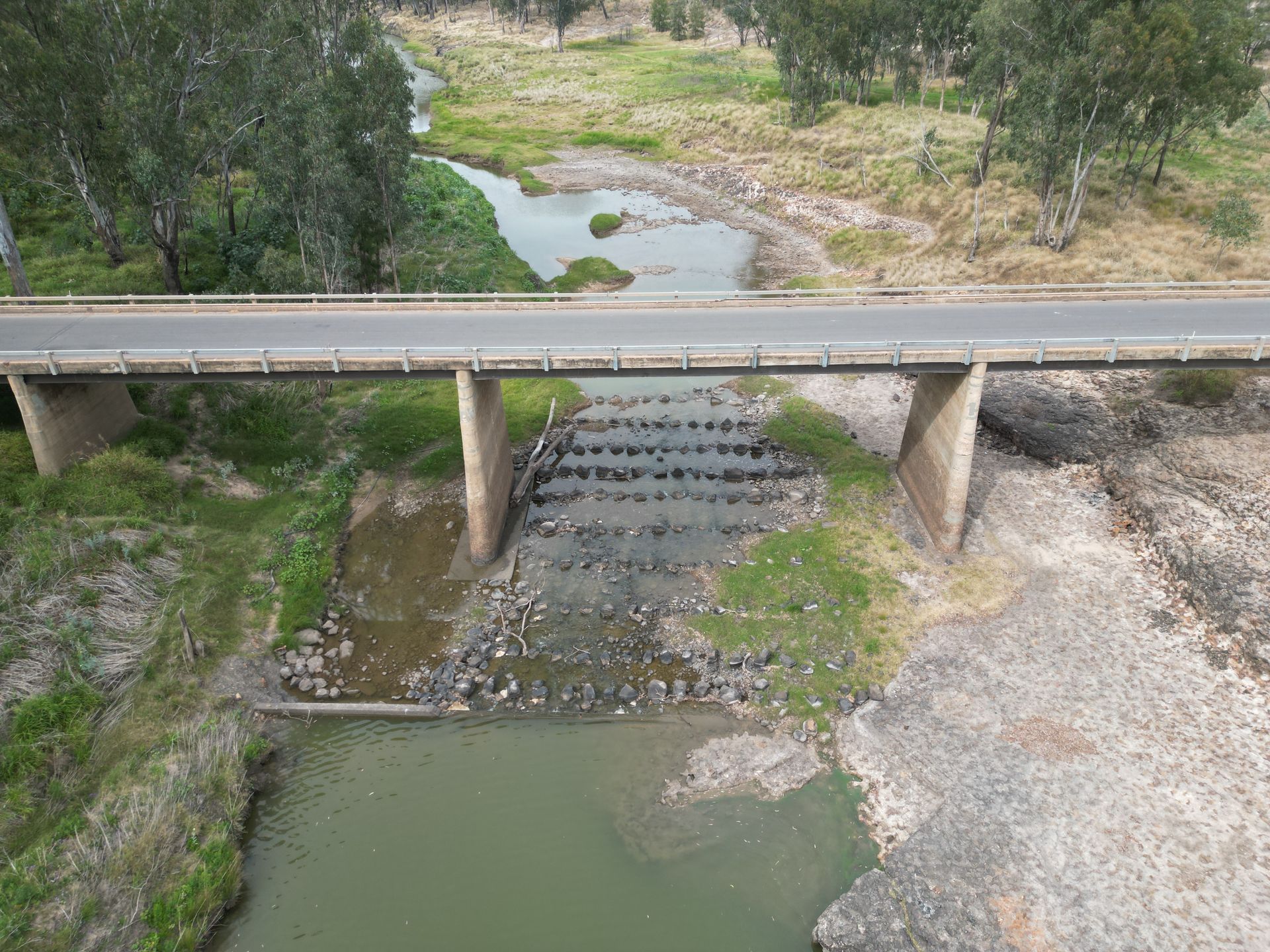An aerial view of a bridge over a river.