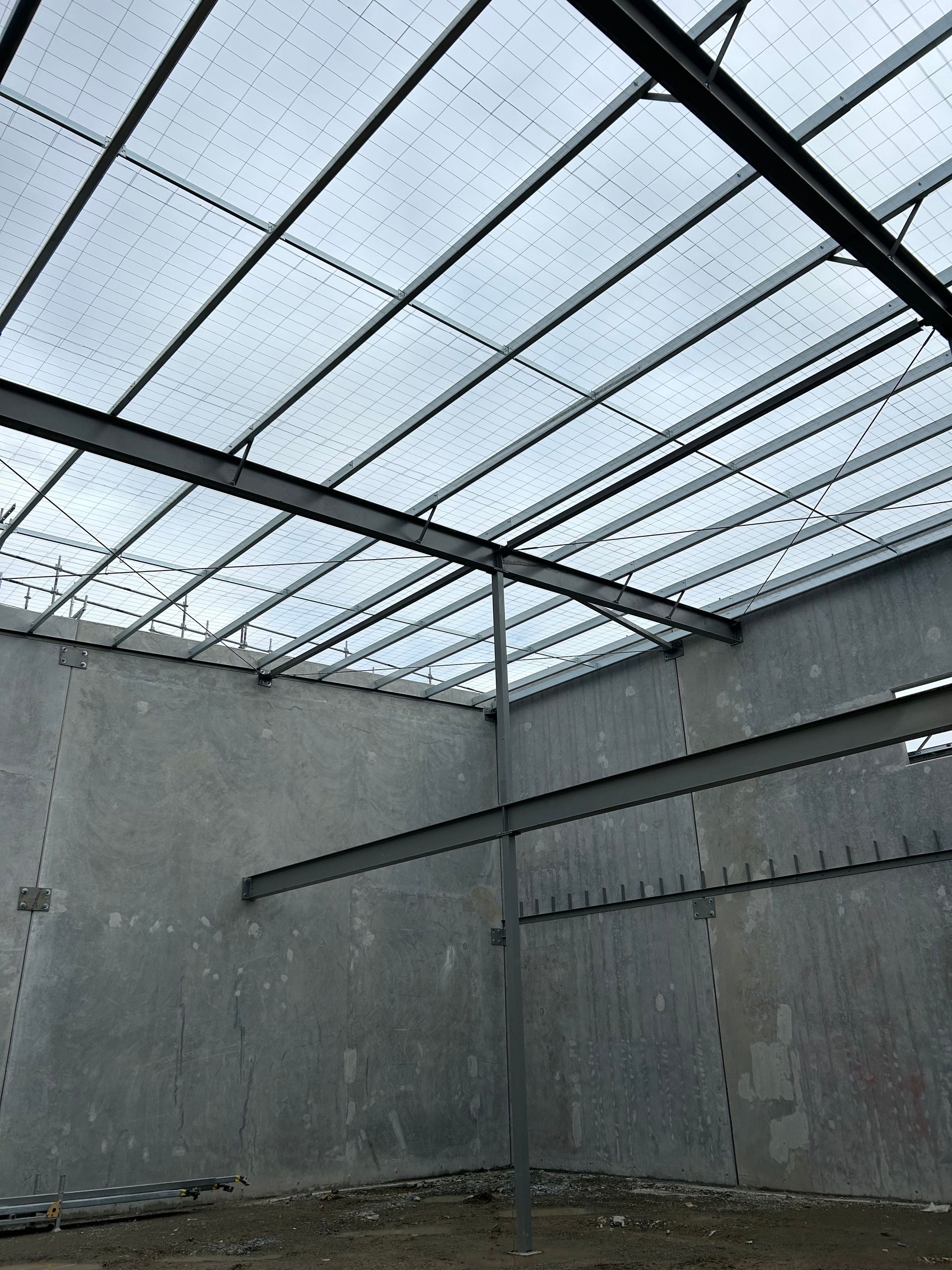 The inside of a building with a clear roof.