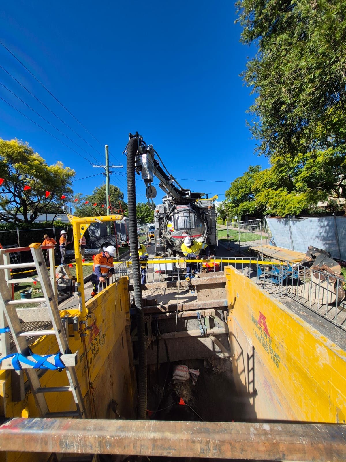 A group of construction workers are working on a construction site.