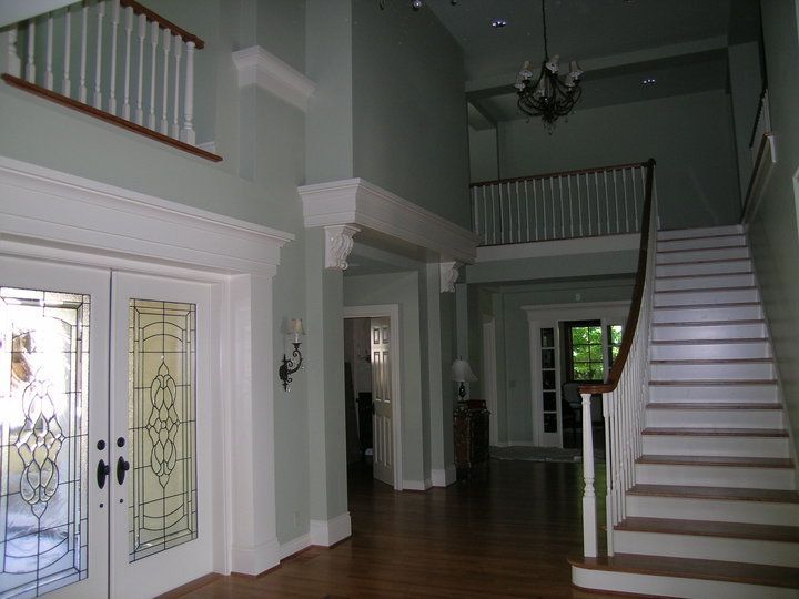 A Staircase with Black Steps and White Railings — Seattle, WA — Progressive Painting Inc.