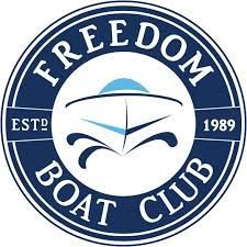 The logo for the freedom boat club shows a boat in a circle.
