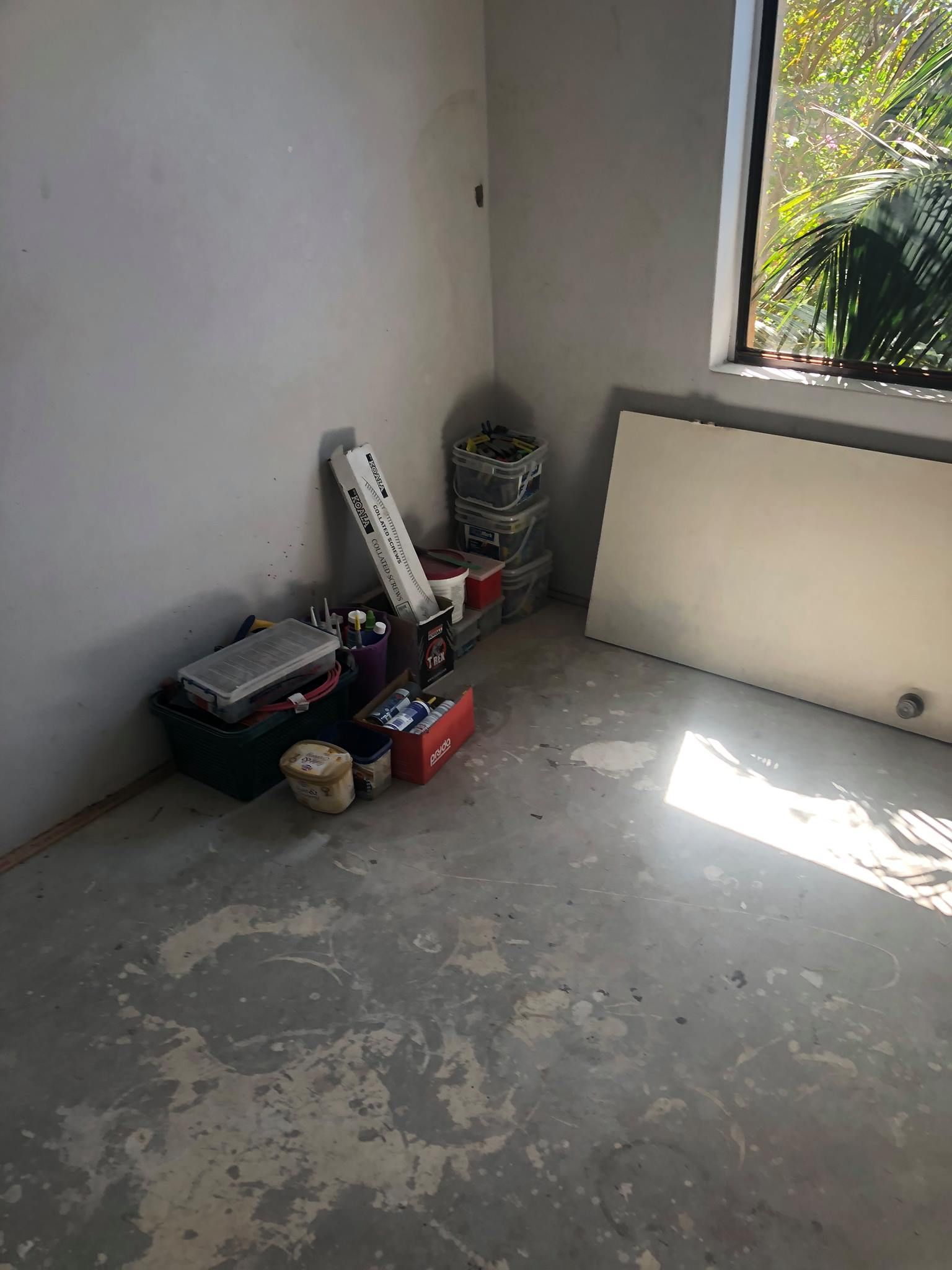 Room With a Window and a Bunch of Boxes on the Floor — Hancock Construction & Maintenance in Newcastle, NSW