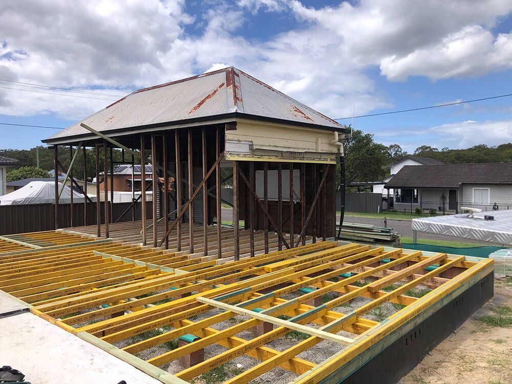 House is Being Built With Wooden Beams and a Roof — Hancock Construction & Maintenance in Maitland, NSW