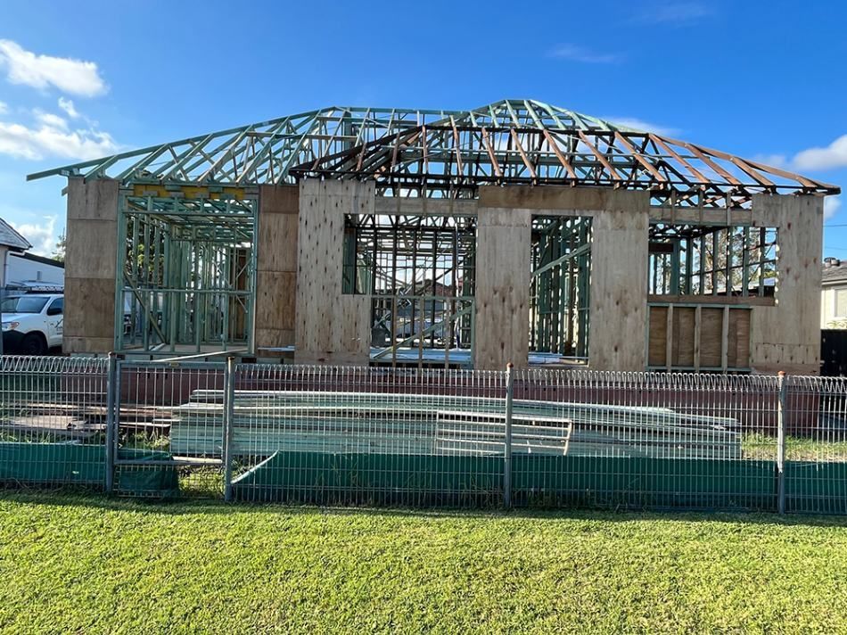 House is Being Built With a Fence Around It — Hancock Construction & Maintenance in Newcastle, NSW