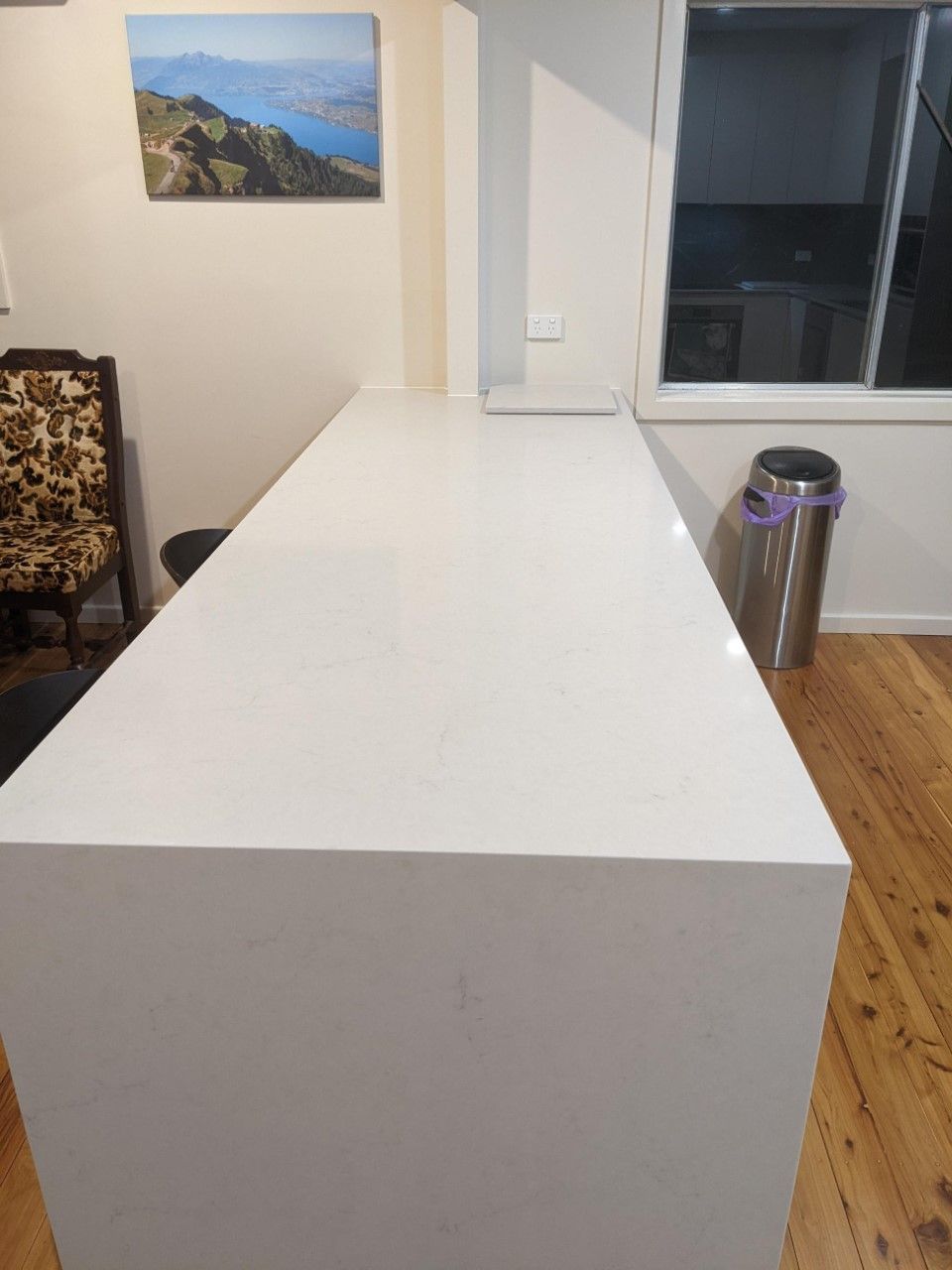Kitchen With a Large White Counter Top and a Stainless Steel Trash Can — Hancock Construction & Maintenance in Lake Macquarie, NSW
