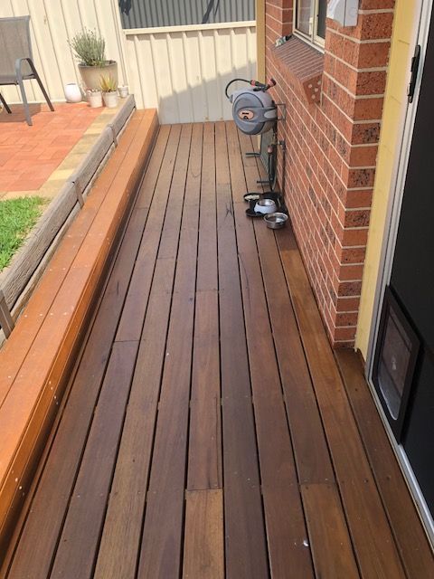 Wooden Deck With a Brick Wall — Hancock Construction & Maintenance in Port Stephens, NSW