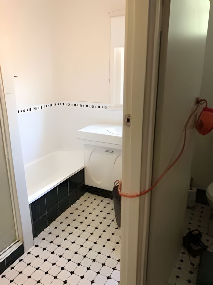 Bathroom With a Bathtub , Sink , Toilet and Shower — Hancock Construction & Maintenance in Newcastle, NSW