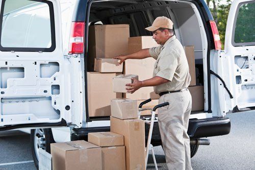 Worker Loading Boxes on a Van — Indianapolis, IN — Capitol City Container Corp