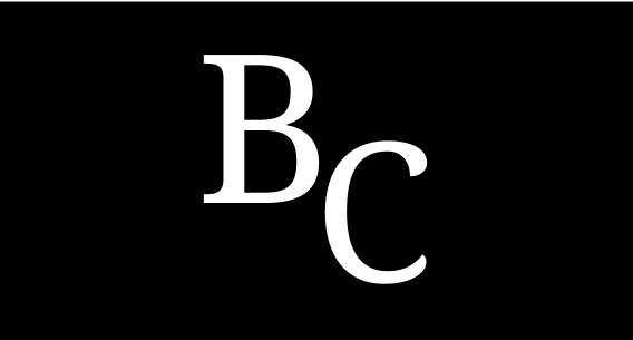 A man is standing in front of a runway with planes in the background.