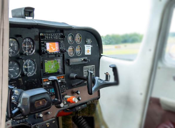 A close up of the cockpit of a small airplane.